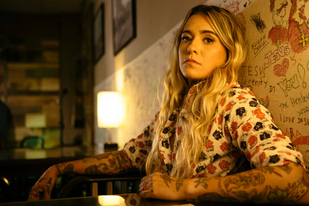 Female Singer has a Deer Tattoo