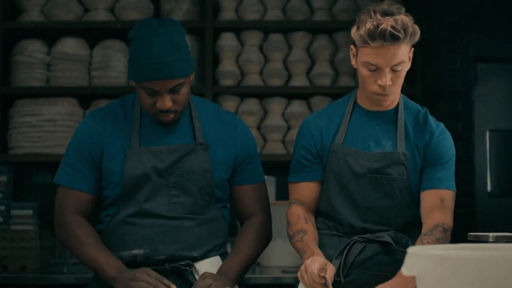 Will Poulter cooking in a kitchen