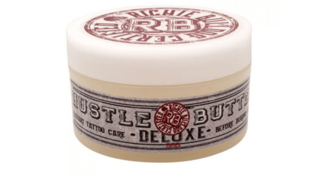 Applying Hustle Butter Tattoo